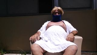 Milky t-shirt and micro-skirt outdoors displaying baps and trunk