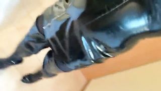 in PVC sundress and footwear spandex mittens