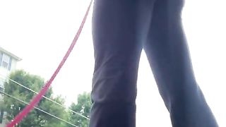 Trampy crossdresser cock-squeezing yoga trousers public street