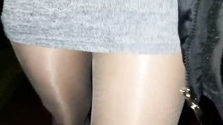 Ambling on the street in pantyhose