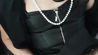 Candice in dark-hued vinyle