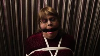 Dani T Leather trussed in string