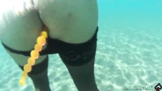 dark-hued tights and assfucking beads in the river