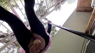 Rosy Emo Maid in v-card railing a faux-cock on public balcony