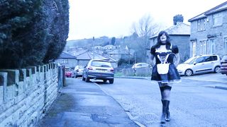 French maid crossdresser outdoors on a council estate