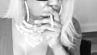 HIGHLY BUXOM DARK-HUED CROSSDRESER SMOKING