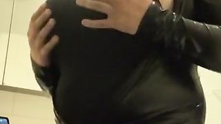 transgender in leather suit