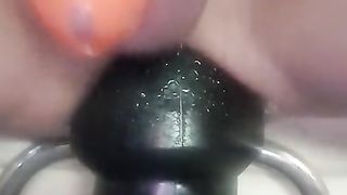 Christina takeing a yam-sized huge Black ass-plug 10cm in diameter