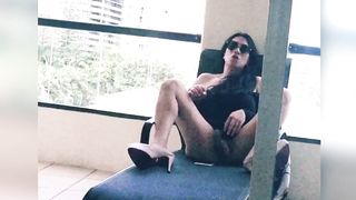 chinese she-male draining her hefty rod in her motel balcony