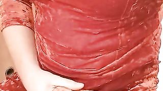 Crossdresser in Orange velvet sundress draining