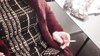 Crossdresser smoking in high stilettos