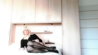 Super-Sexy Crossdresser Tights and high high-heeled shoes on couch