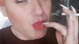 transvestite Sonyastar smokes, long ravages, crimson hair