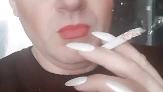 transvestite Sonyastar smokes, long ravages, crimson hair