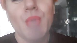 transvestite Sonyastar smokes, long ravages, crimson hair