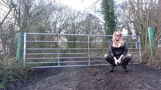 UK Whore in vinyl Posing Outdoors