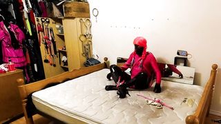 Self Restrain Bondage Armbinder Frog-Tie in vinyl Catsuit and Lycra Gimp Outfit with V-Card Belt and Faux-Cock Locked in Place