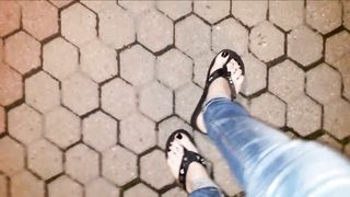 a crossdresser on a night walk ambles around and entices with his luxurious soles