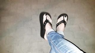 a crossdresser on a night walk ambles around and entices with his luxurious soles