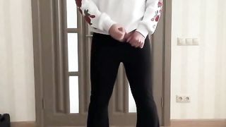 Sissy in flared shoe cut black pants and white hoodie with roses jerking and dancing for your delight