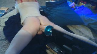 Crossdresser lays on the floor and gets screwed by her machine!