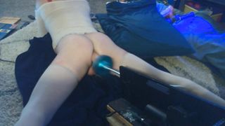 Crossdresser lays on the floor and gets screwed by her machine!