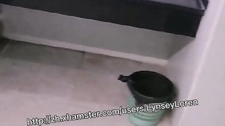 Lynsey jerks in front of a public restroom