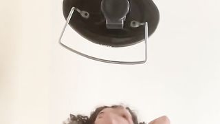 Long haired femboy sits on their rod