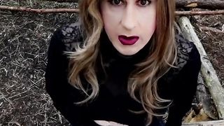 Sissy Alexandra is waiting for dudes in the woods while dressed in hip high shoes