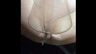 Sissy pissing in her stockings outside