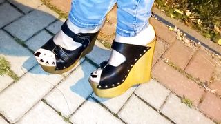 crossdresser demonstrates off her jaw-dropping soles in high heel sticks in public