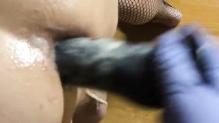 Close Up Domina porks and smacks sissys backside with black faux-cock