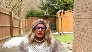 Fledgling crossdresser Kellycd2022 glorious cougar pissing her underpants in tights high-heeled shoes vinyl sundress outdoors