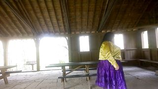 Molly is Dancing in the park while toying soiree music displaying her donk and green silk undies with purple tights