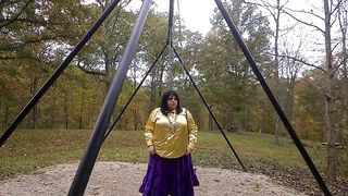 Wondrous Crossdresser at the park getting prepared to embark flapping on the sway in the park.