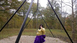 Wondrous Crossdresser at the park getting prepared to embark flapping on the sway in the park.