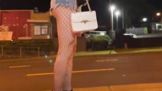 Pretend to be a escort and de-robe myself in a public street at night