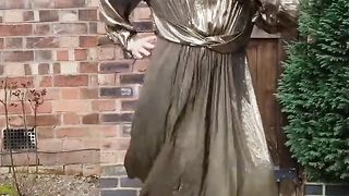 Sissy crossdresser outdoors in gold metallic glistening sundress