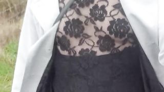 Crossdresser takes a walk on a windy lane