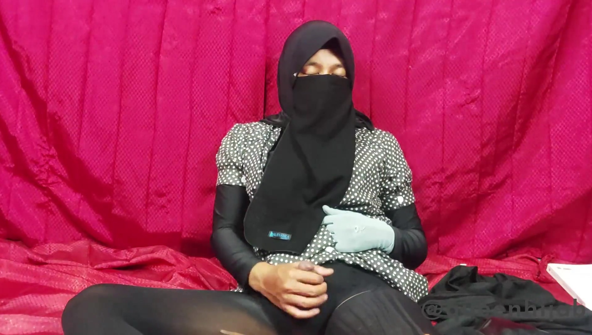 A veiled woman with desire in her eyes