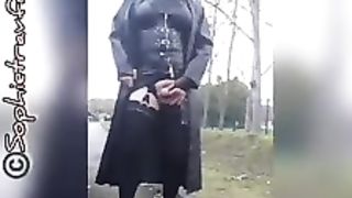 sandy-haired sissy ambles outside in black PVC fetish apparel