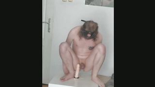 Bony guy leaps on a giant faux-cock