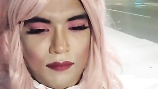 Sissy maid at public bus stop