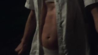 Bella does a night time undergarments walk down the street