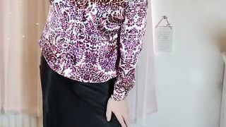Crossdresser in satin half-top and micro-skirt