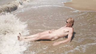 Swimming, spraying and posing bare in the river...