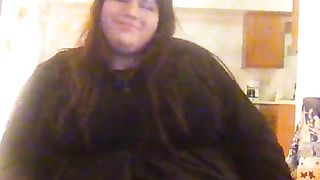 Molly is dressed in her black sundress petting herself showcasing her blue silk undies under her sundress