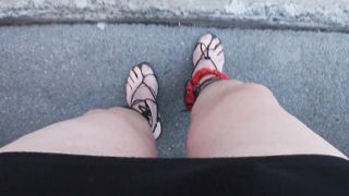 A sissy Mature CD whoring on the streets in the daylight dressed in Underwear high-heeled slippers underpants brief miniskirt