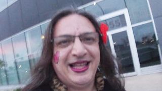 A sissy Mature CD whoring on the streets in the daylight dressed in Underwear high-heeled slippers underpants brief miniskirt