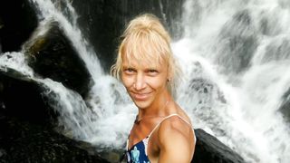 Alexa Cosmic swimming in cool waterfall dressed in colorific combi sundress...
